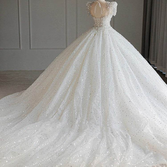 Stunning Bridal Dress with Large Trailing Tail - Stylish 2025 Wedding Gown - Buy Center